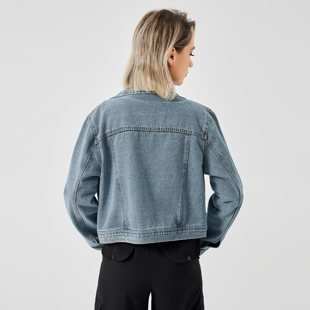 Fashionable women's long sleeve denim jacket with a stylish design.