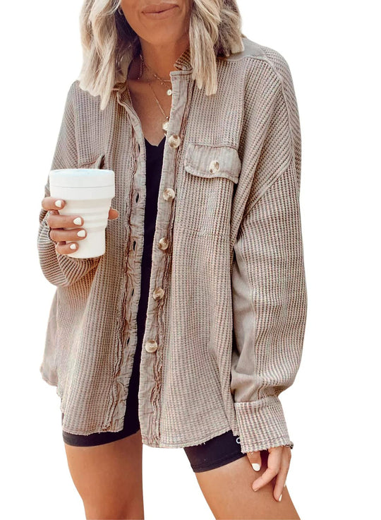 Fashionable women's button-up shirt jacket with lapel collar, long sleeves, and blouse-style top.