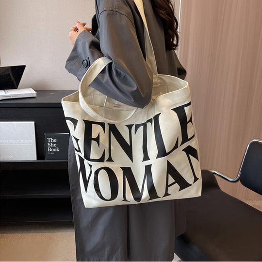 Gentlewomen Tote Bag - A spacious canvas bag with a stylish letter print, perfect for travel, casual outings, and everyday shopping.