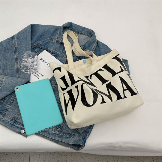 Gentlewomen Tote Bag - A spacious canvas bag with a stylish letter print, perfect for travel, casual outings, and everyday shopping.