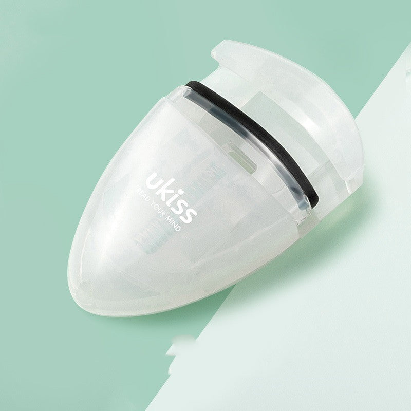 Mini portable eyelash curler.