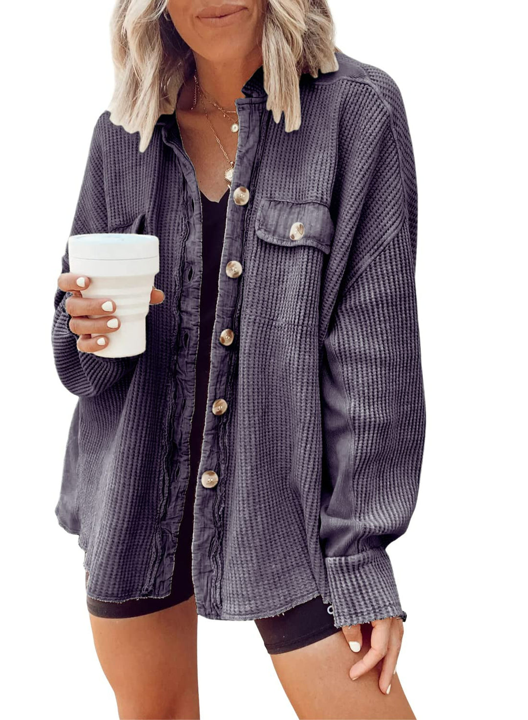 Fashionable women's button-up shirt jacket with lapel collar, long sleeves, and blouse-style top.
