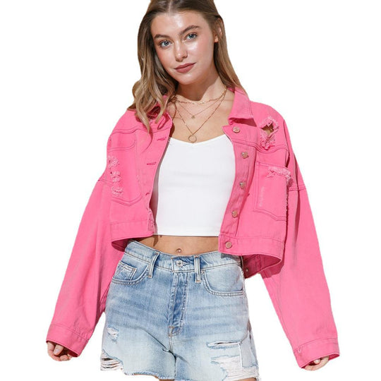 Stylish denim jacket for women with ripped details, rhinestone embellishments, tassel accents, and long sleeves.