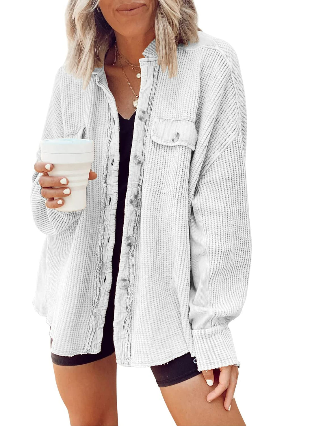 Fashionable women's button-up shirt jacket with lapel collar, long sleeves, and blouse-style top.