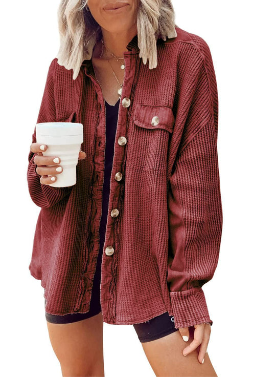 Fashionable women's button-up shirt jacket with lapel collar, long sleeves, and blouse-style top.
