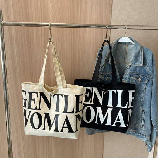 Gentlewomen Tote Bag - A spacious canvas bag with a stylish letter print, perfect for travel, casual outings, and everyday shopping.