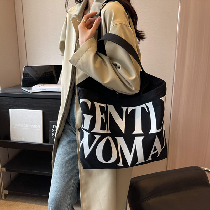 Gentlewomen Tote Bag - A spacious canvas bag with a stylish letter print, perfect for travel, casual outings, and everyday shopping.
